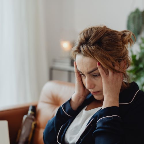 a lady suffering from stress and booking reiki treatment